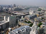 London St. Pauls Cathedral 09 Golden Gallery View Of Thames We climbed 86m to the Golden Gallery at St. Pauls Cathedral and enjoyed a spectacular view of London. Here is the view to the south west with the Thames River snaking through London, and the London Eye ferris wheel visible on the horizon.